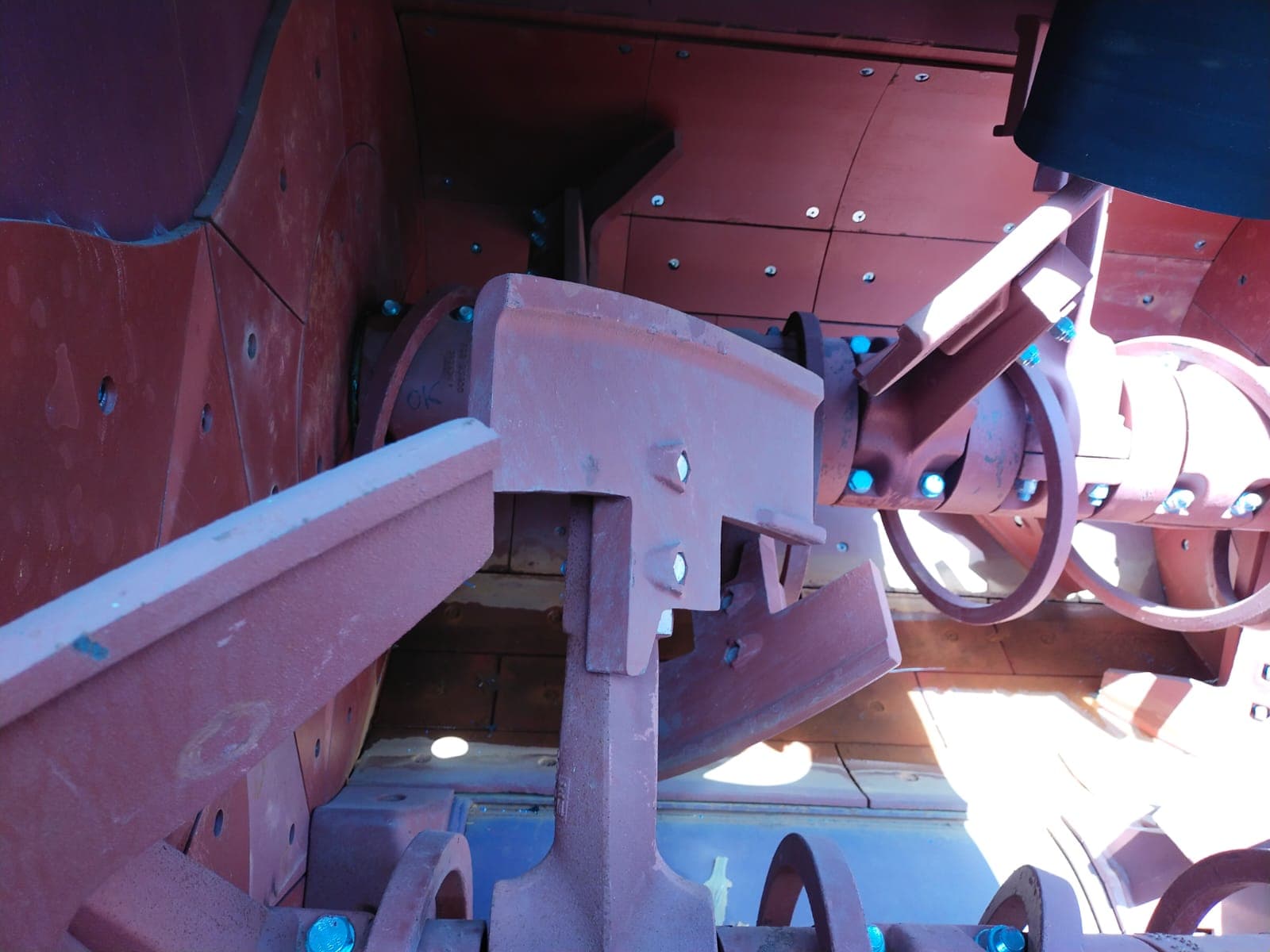 Close-up of mixer paddles with torque-marked bolts